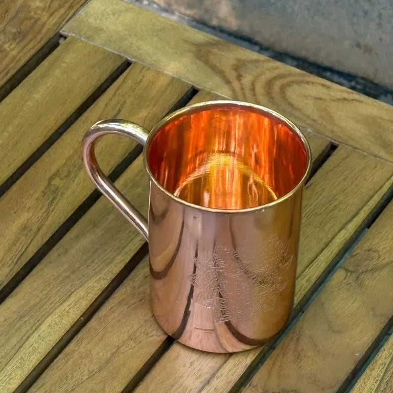 Copper mug mandala etching close-up detail
